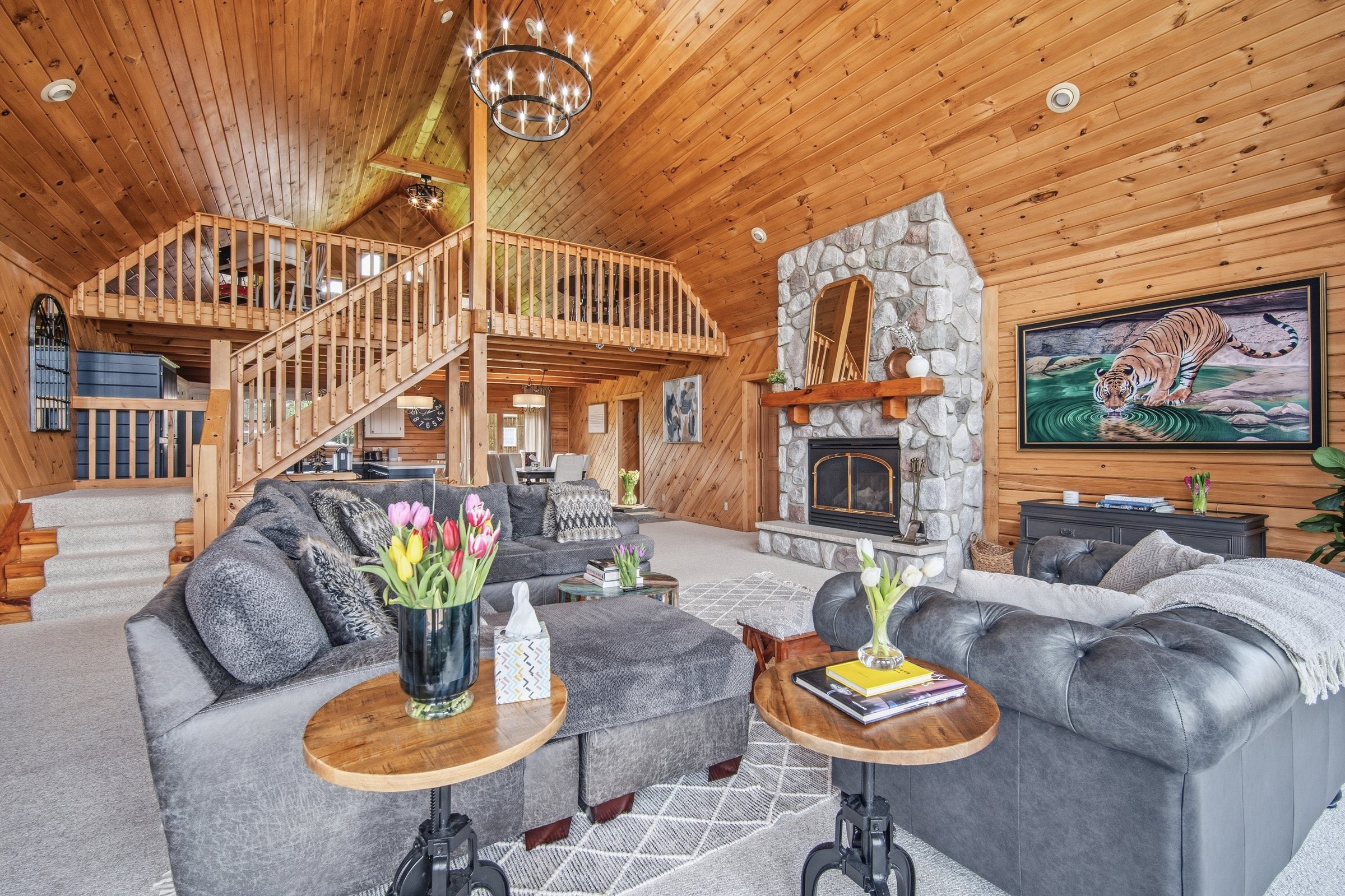 Downstairs living room with stone fireplace