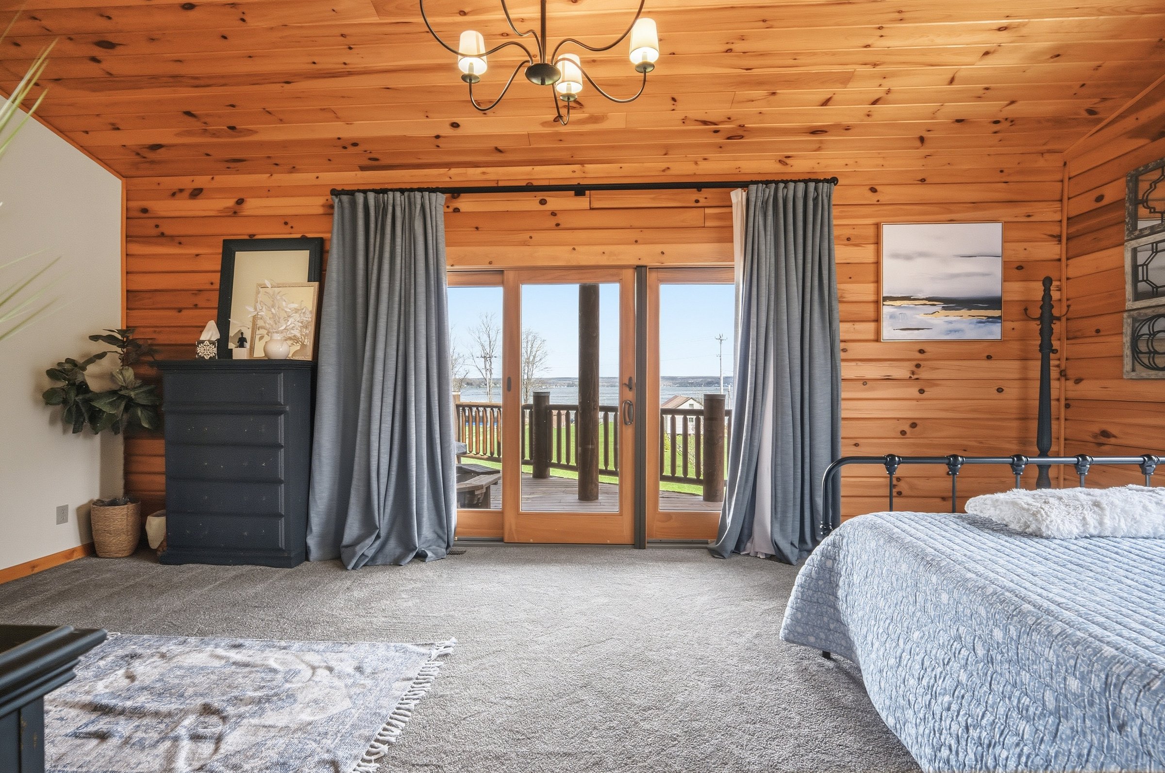 Primary bedroom looking out to the lake